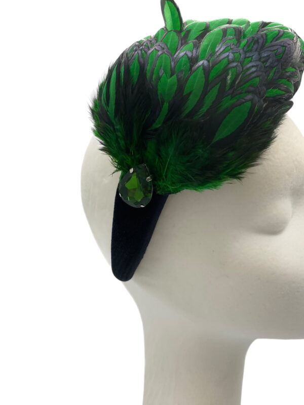 Stunning emerald green and black feather crown with little jewel detail to finish.